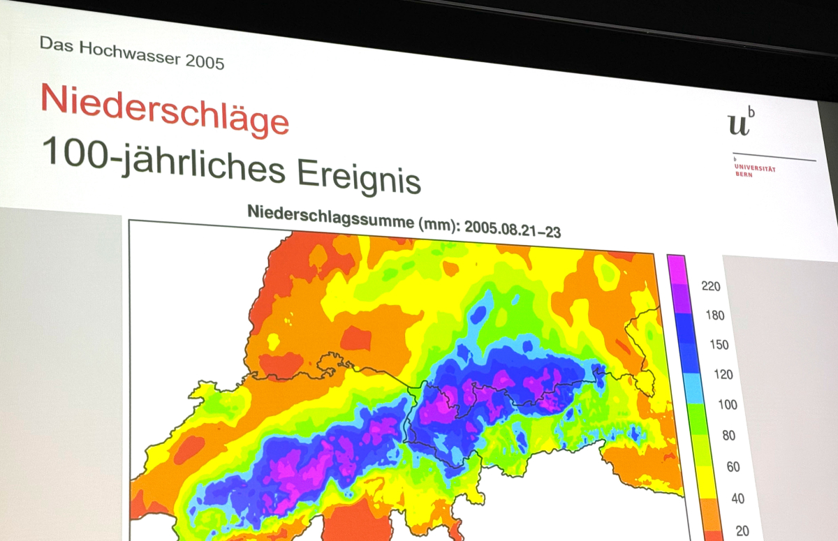 Visualization of precipitation data from the 2005 Swiss floods, presented by the University of Bern. The map highlights rainfall intensity (in mm) from August 21–23, 2005, showcasing a 100-year flood event across central Switzerland.